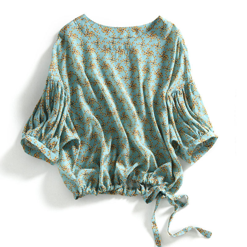 Blusa feminina cropped com manga lanterna e estampa floral