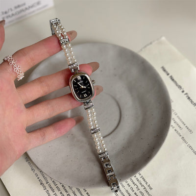 Relógio feminino oval com disco simples e fashion de pérola